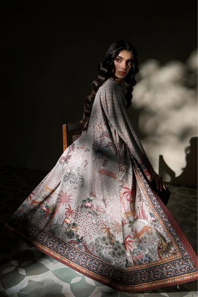 Woman wearing Manto's long, patterned coat in an indoor setting, featuring Urdu calligraph & Illustration