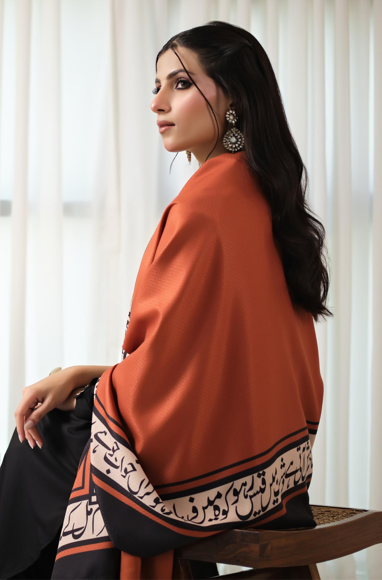 Manto's Unisex Rustic Orange Winter Shawl featuring Urdu Calligraphy on the Borders