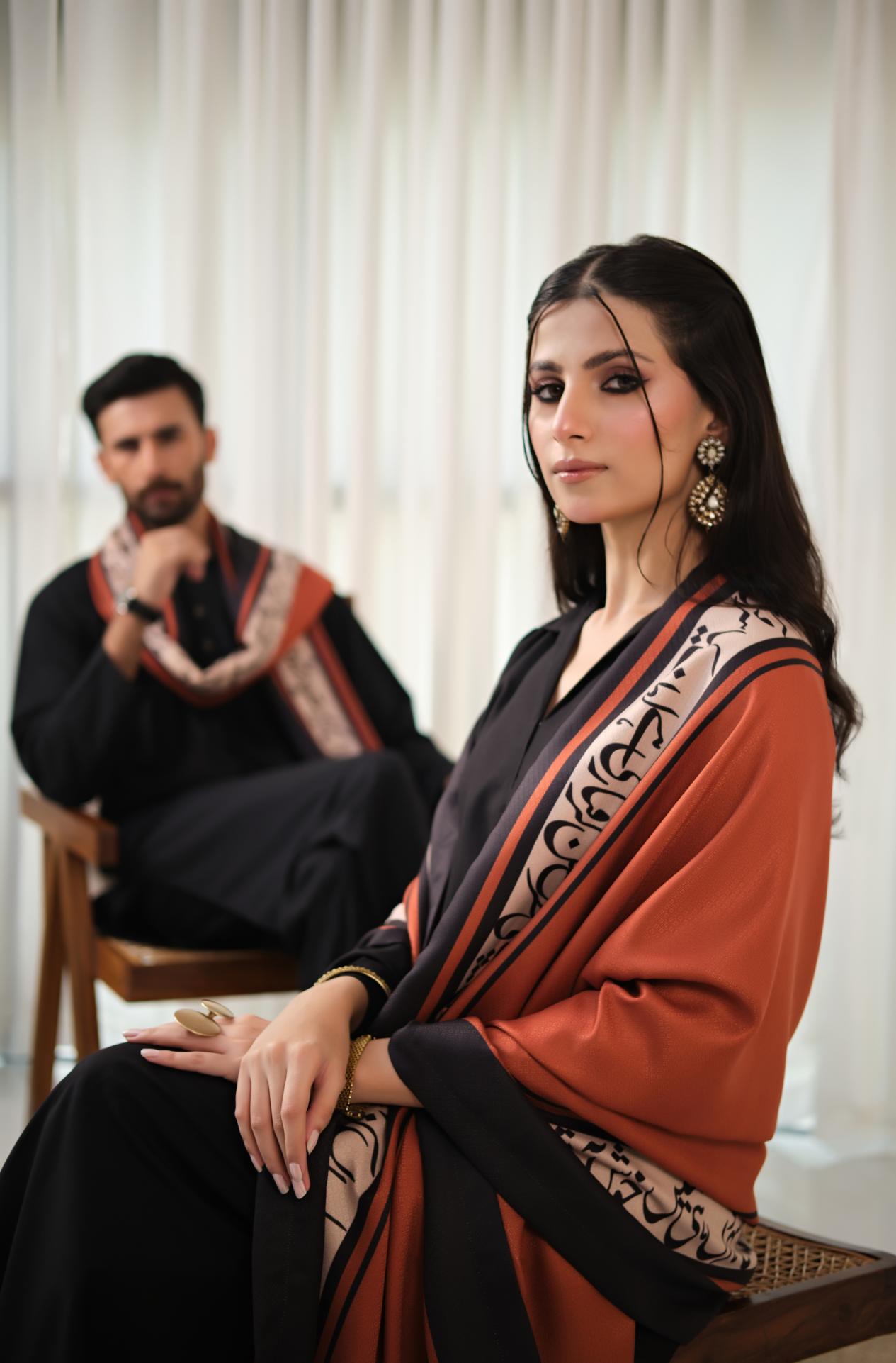 Manto's Unisex Rustic Orange Winter Shawl featuring Urdu Calligraphy on the Borders