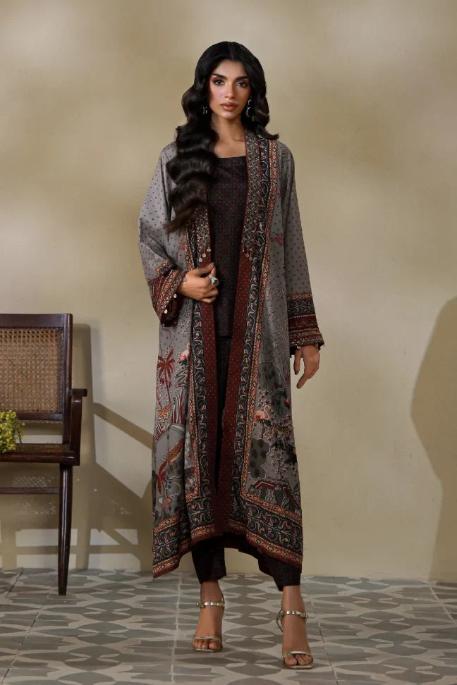 Woman wearing Manto's long, patterned coat in an indoor setting, featuring Urdu calligraph & Illustration