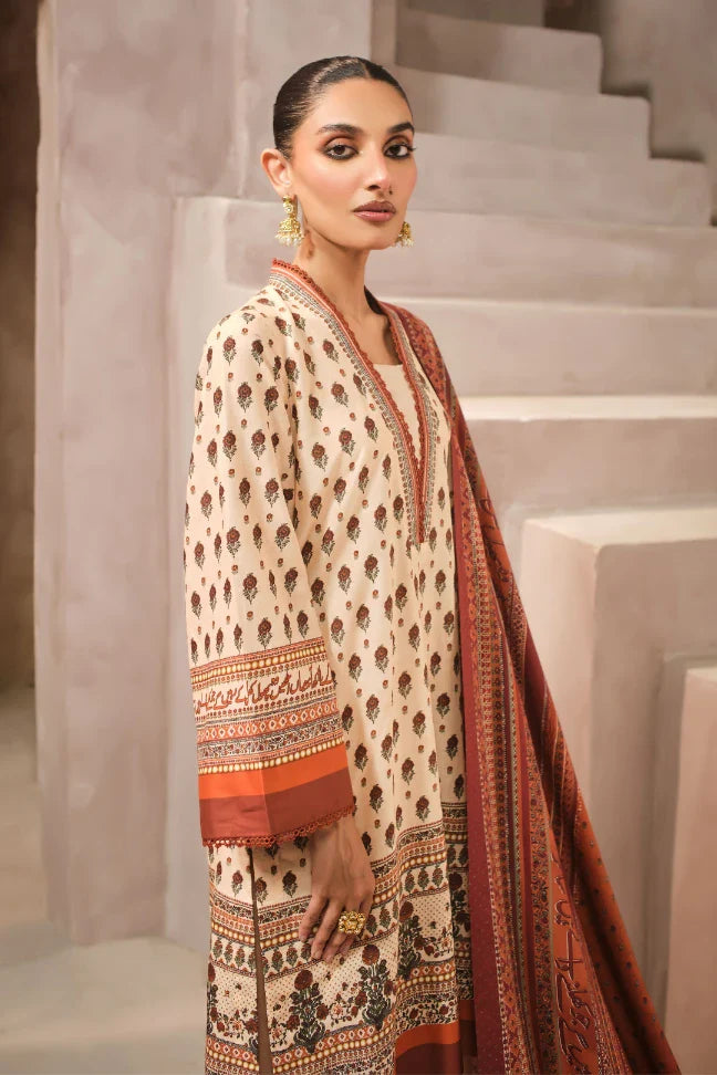 Woman wearing a patterned outfit with a scarf in an indoor setting