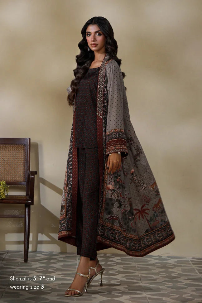 Woman wearing Manto's long, patterned coat in an indoor setting, featuring Urdu calligraph & Illustration