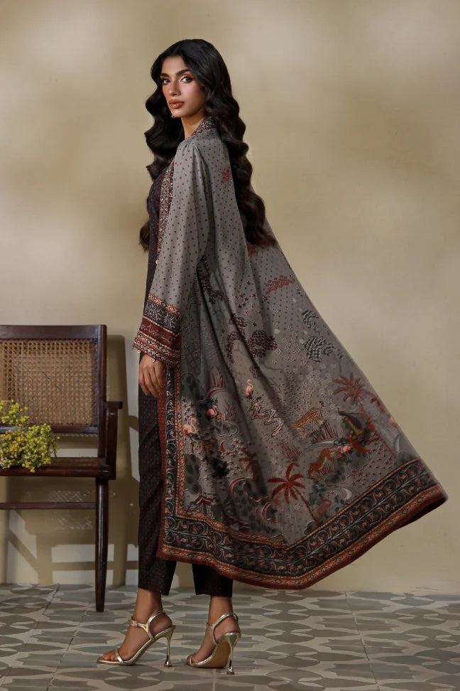 Woman wearing Manto's long, patterned coat in an indoor setting, featuring Urdu calligraph & Illustration