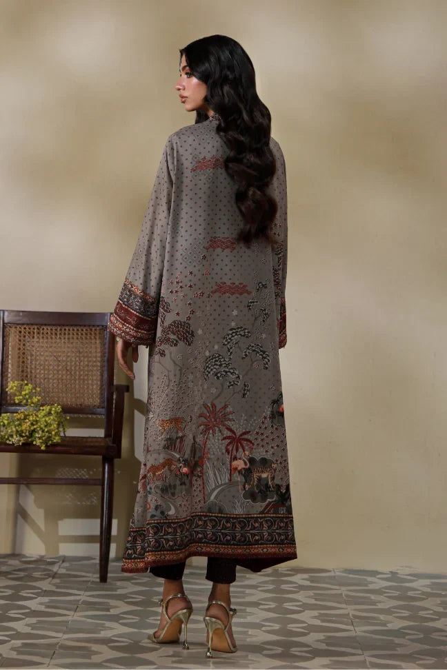 Woman wearing Manto's long, patterned coat in an indoor setting, featuring Urdu calligraph & Illustration