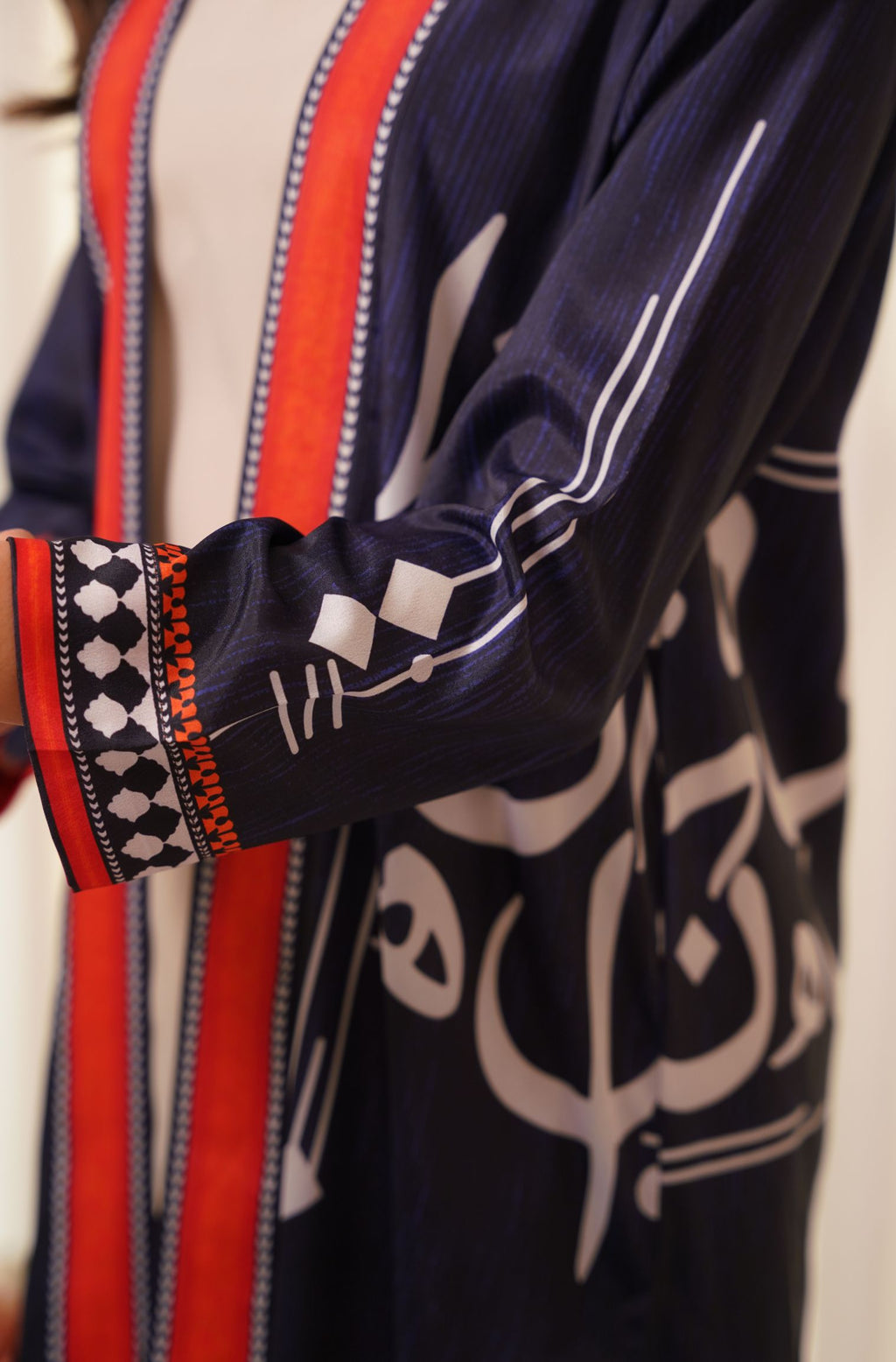 Shopmanto, wear manto, manto clothing brand, manto pakistan, ladies clothing brand, urdu calligraphy clothing, wear manto shades of dusk women front open upper cape sooraj shrug with urdu calligraphy
