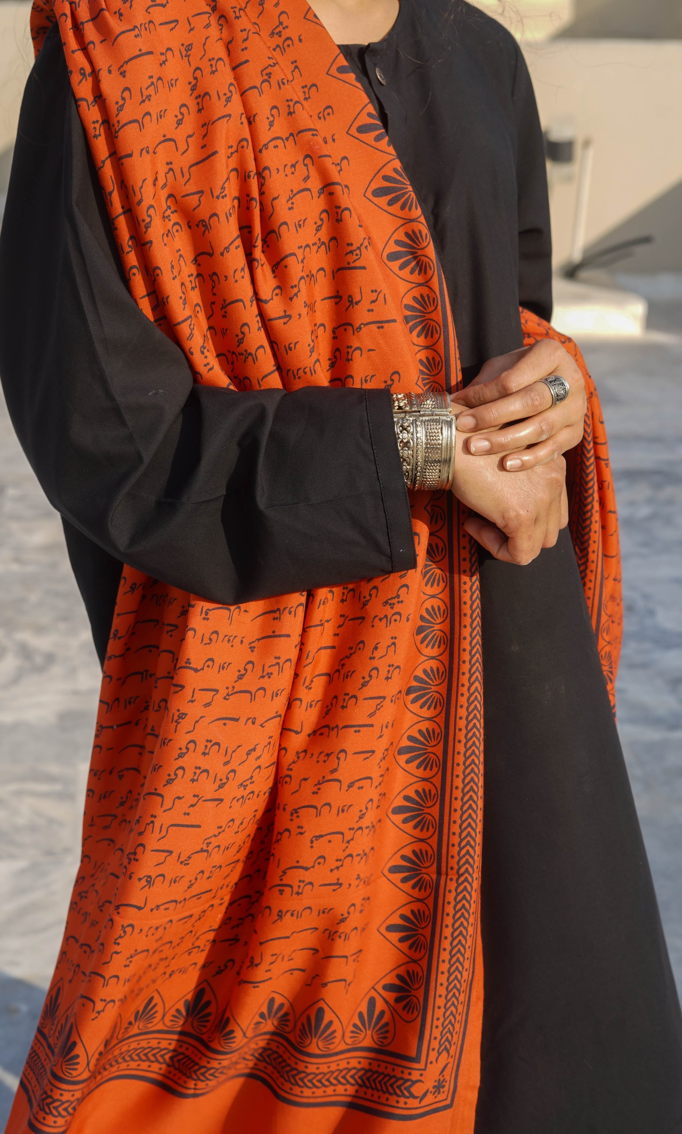 Orange cotton silk Manto calligraphy odhni/ dupatta with Allama Iqbal’s ghazal ‘Sitaron Se Agay Jahaan Aur Bhee Hain’ printed