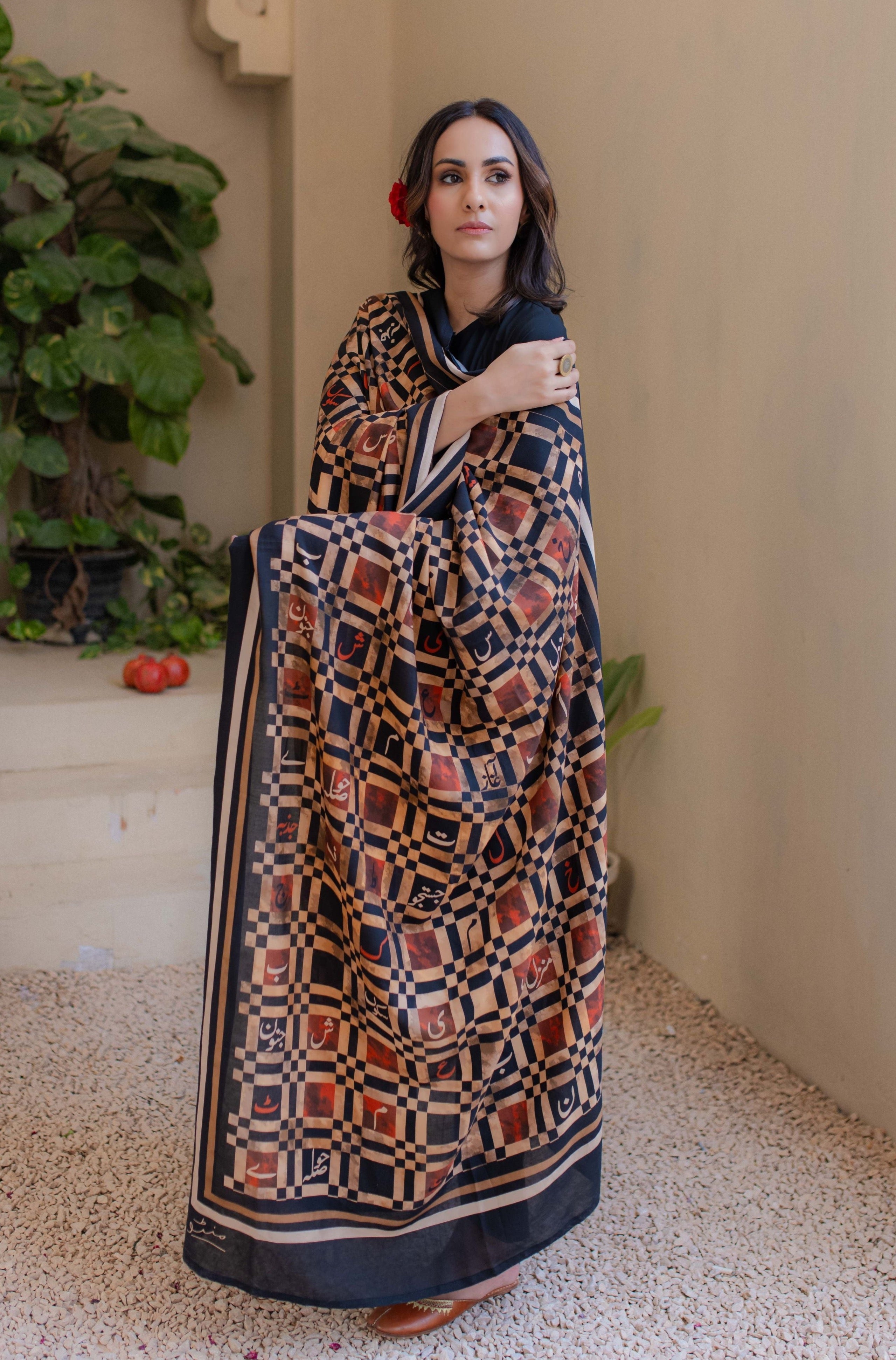 Shopmanto, wear manto, odhni, shawl, chaddar, manto odhni, manto scarves, manto stoles, manto, clothing brands, women shawl, ladies shawl, women shawl in black, women shawl with random words calligraphed in urdu, urdu calligraphy, urdu calligraphy clothes, manto calligraphy clothes, alfaaz odhni, shades of fire, manto alfaaz odhni